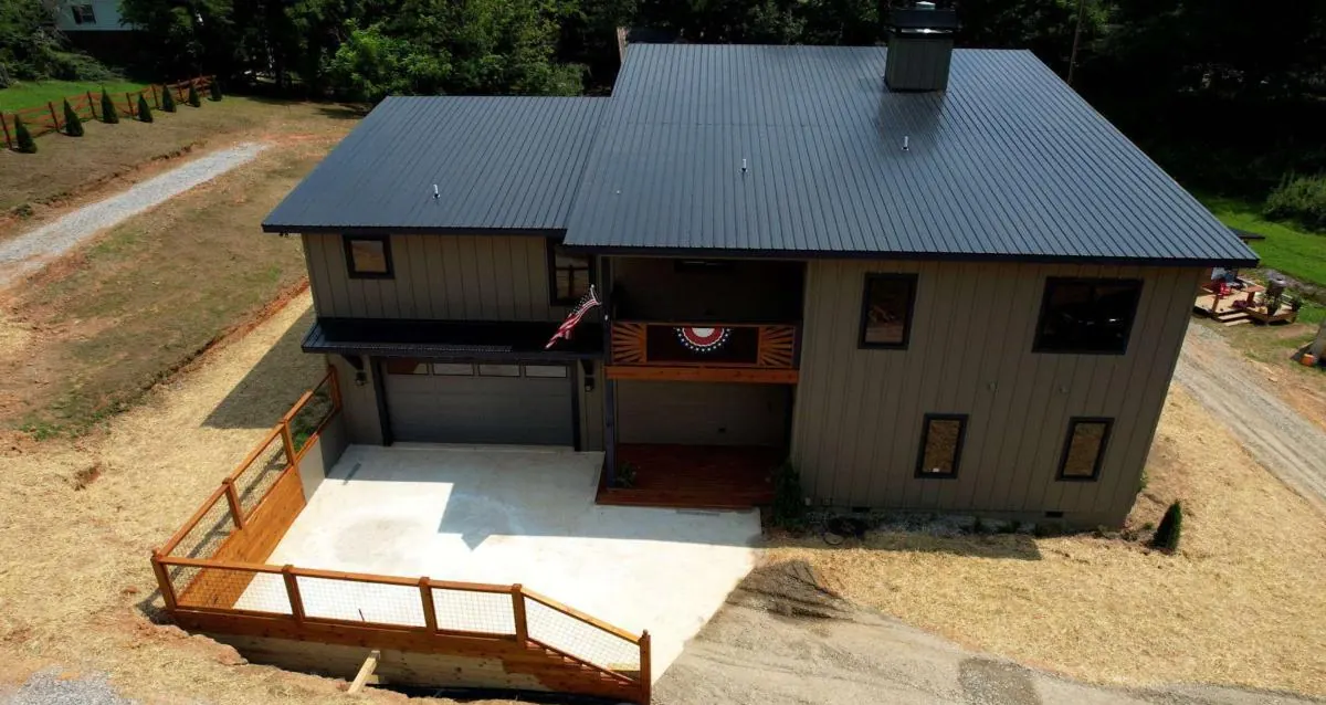Aerial view of the front of the house, garage and parking pad