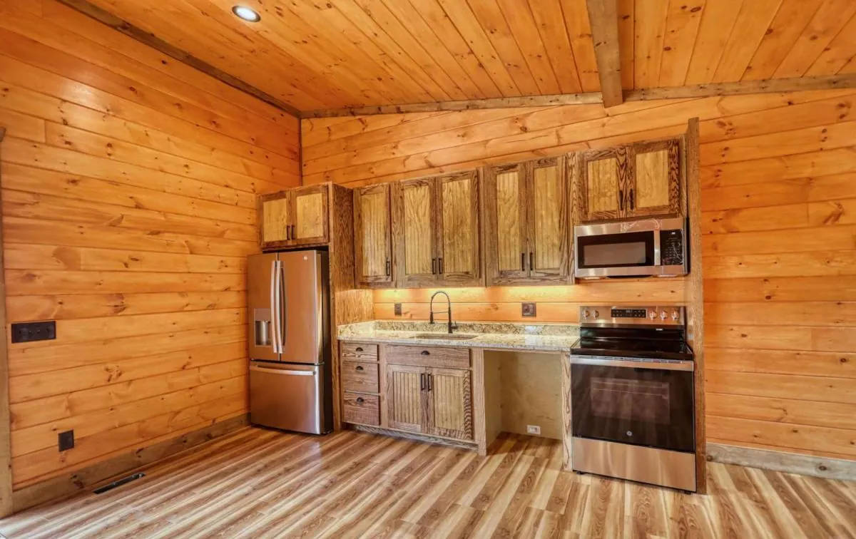 Third kitchen with pine cabinets and stainless appliances