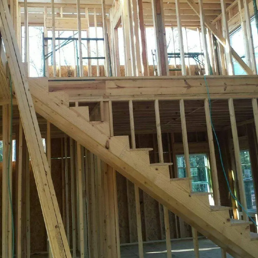 Interior wall and stair framing in a house under construction