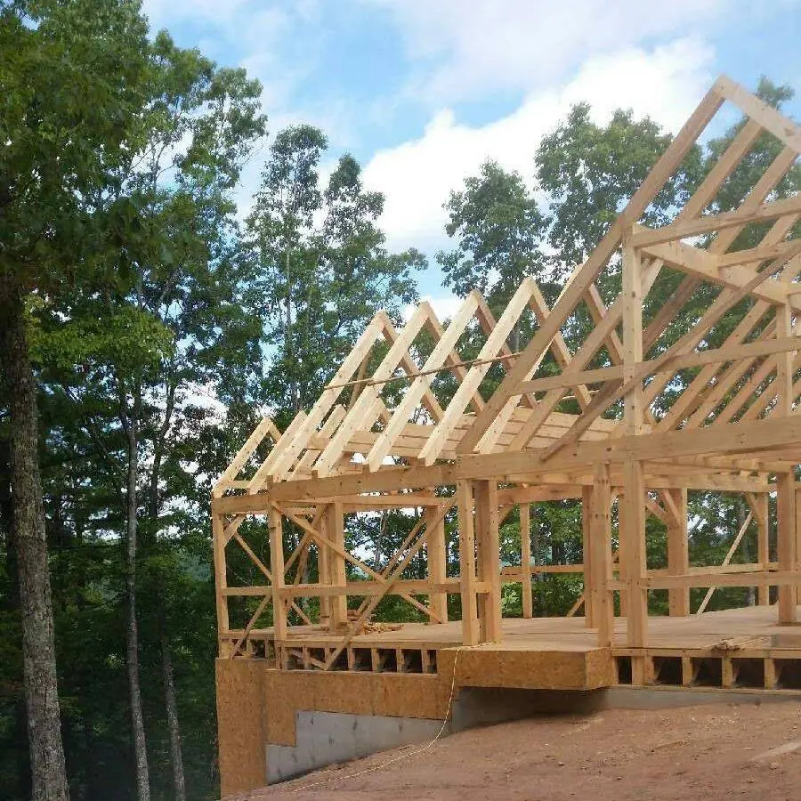 Roof trusses set on a newly framed building on a mountain lot